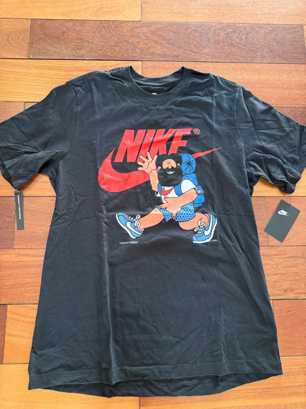 Nike Black Short-Sleeve Tee with Red Logo and Colorful Runner Graphic
